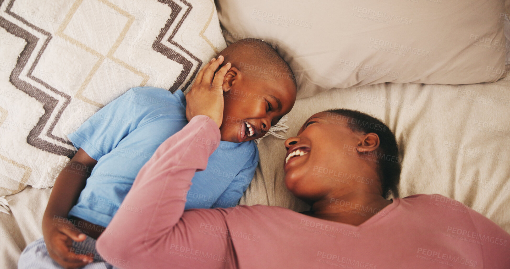 Buy stock photo Boy, mom or laugh in bedroom with support, love or black family for bonding, safety and care. African parent, above or happy single mother with child in house with funny joke, affection and trust