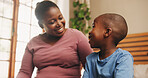Home, black family and mother with boy, conversation and bonding together in bedroom. African parent, mama and son with discussion, smile and happiness with love, chatting and break with child