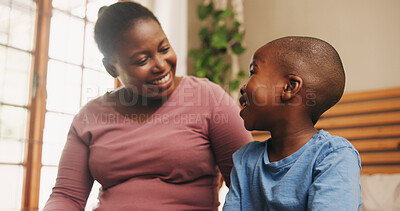 Buy stock photo Home, black family and mother with boy, conversation and bonding together in bedroom. African parent, mama and son with discussion, smile and happiness with love, chatting and break with child