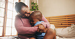 Boy, mom or hug in bedroom with support, love or black family for bonding, safety or care. African parent, male kid or single mother with child in house with protection, affection or trust in Nigeria