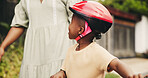 Hands, outdoor and boy on bicycle with parent on street of neighborhood for child development. Woman, love or black kid with trust, help or single mother teaching African son how to ride bike outside