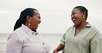 Laugh, mother and daughter with smile on beach for travel, summer holiday and ocean getaway. African, family and mature woman for tropical vacation, funny joke and bonding together for nature trip