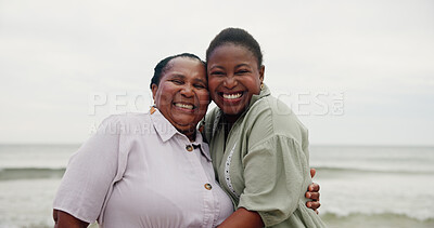 Buy stock photo Portrait, mother and daughter with hug on beach for travel, sea holiday and getaway. African family, laughing and embrace with mature woman, ocean vacation and bonding together on trip in nature