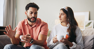 Buy stock photo Couple, talk and coffee with fight on sofa for affair, cheating or stress with discussion in lounge. People, man and woman with conversation for dispute, argument and conflict with tea cup in home