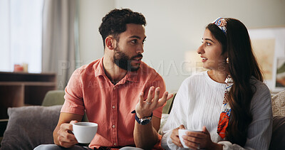 Buy stock photo Couple, talk and coffee with question on sofa in home, communication and bonding in living room. People, man and woman with conversation for connection, relax and listen with tea cup at apartment