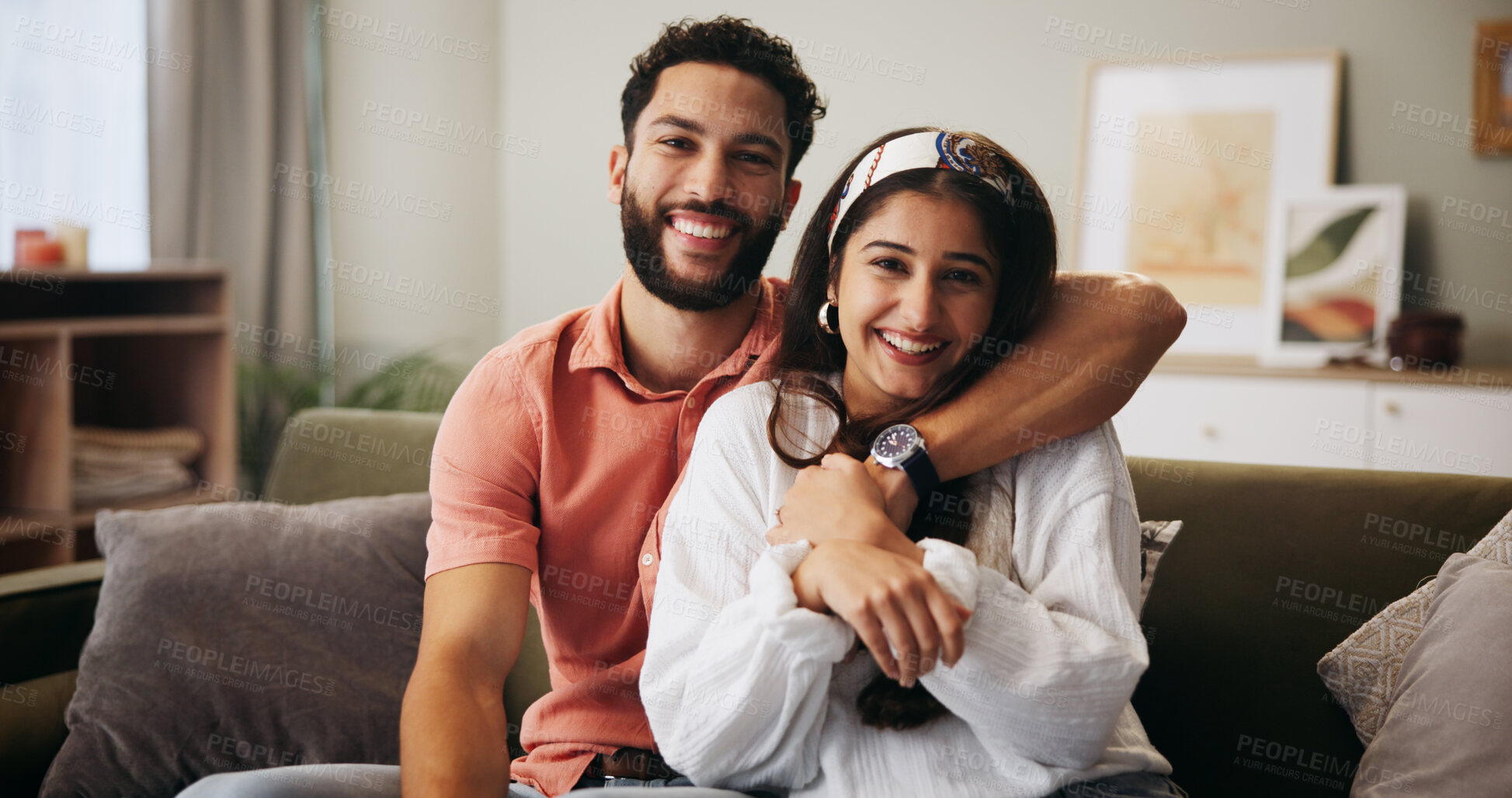Buy stock photo Hug, happy couple and portrait in living room with smile, bonding and weekend date in apartment. Embrace, man and woman with love in house for relationship, joy or care in home lounge for break