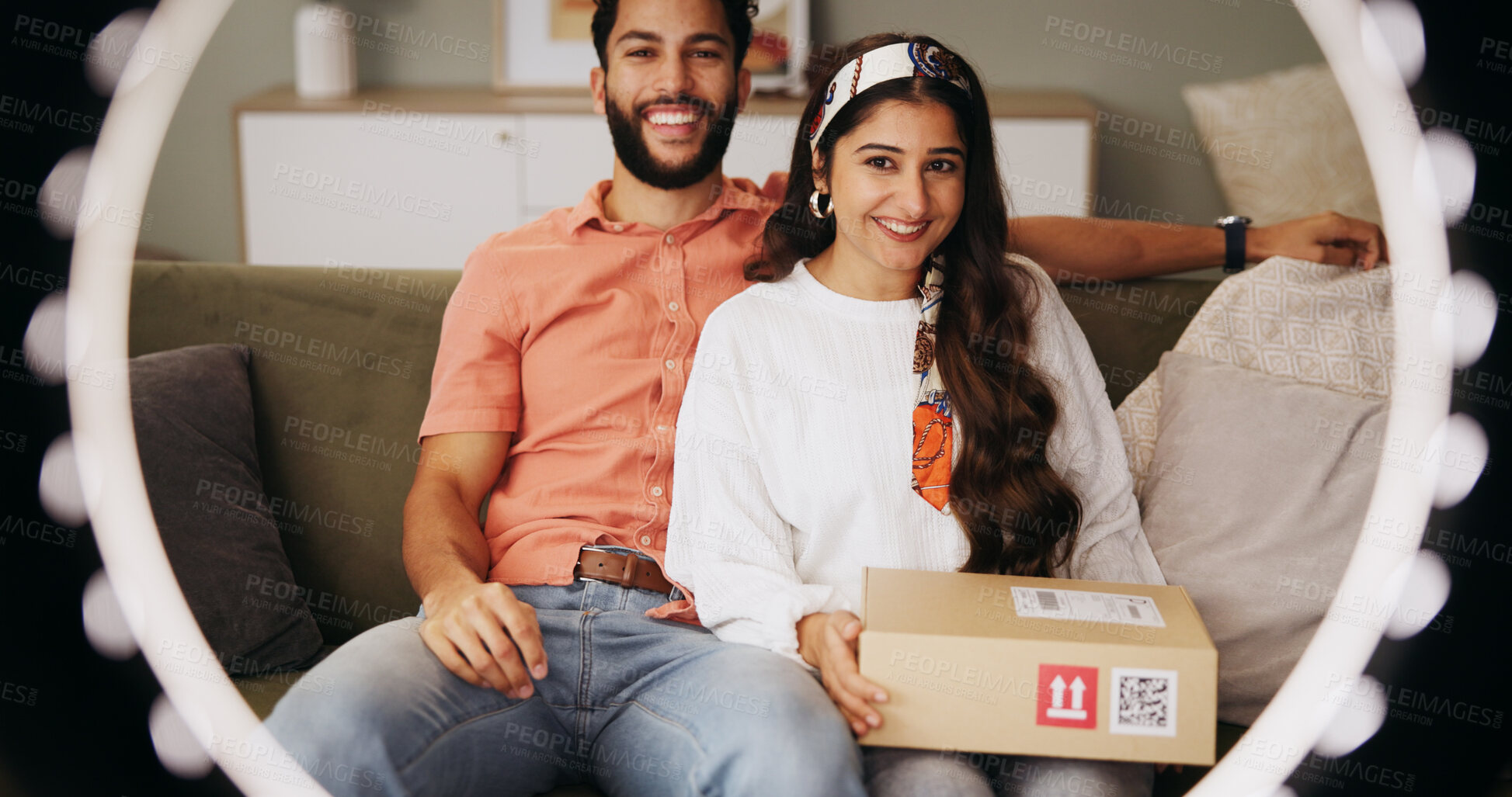Buy stock photo Couple, ring light and box with live stream in home, smile and portrait with post on web in lounge. Influencer, man and woman with unboxing video, recording and happy with social media at apartment