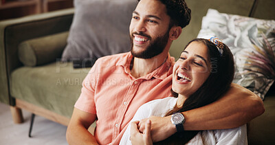 Buy stock photo Hug, couple and laugh in living room with smile, bonding and weekend date in apartment. Embrace, man and woman with love in house for relationship, comedy and funny joke in home lounge for break