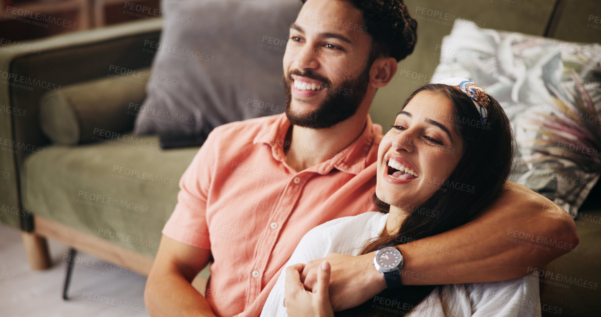 Buy stock photo Hug, couple and laugh in living room with smile, bonding and weekend date in apartment. Embrace, man and woman with love in house for relationship, comedy and funny joke in home lounge for break