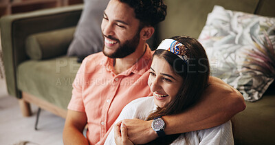 Buy stock photo Hug, couple and comedy in living room with smile, bonding and weekend date in apartment. Embrace, man and woman with love in house for relationship, laugh and funny joke in home lounge for break
