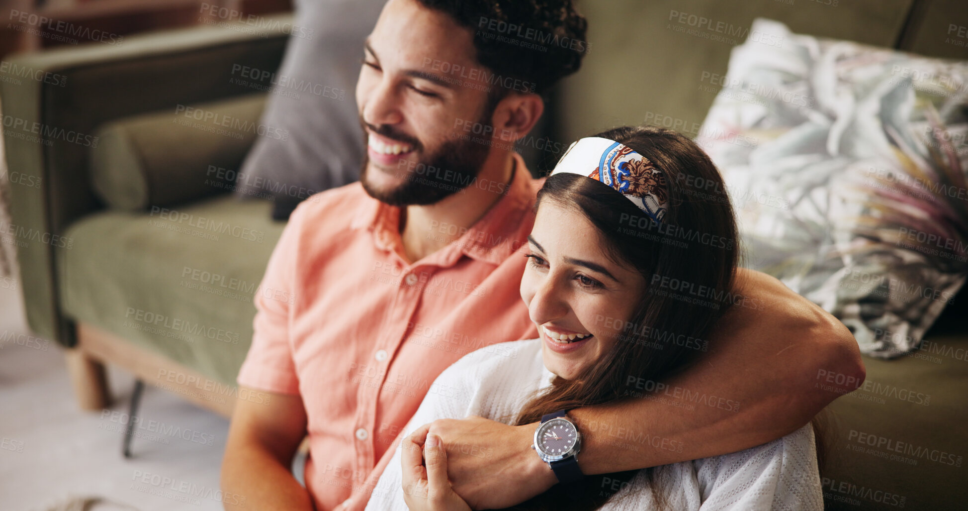Buy stock photo Hug, couple and comedy in living room with smile, bonding and weekend date in apartment. Embrace, man and woman with love in house for relationship, laugh and funny joke in home lounge for break