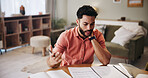 Stress, finance and man with paperwork in home for mortgage, loan payment and taxes. Worry, frustrated and person with documents, account bills and debt for budget, financial crisis and inflation