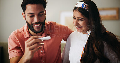 Buy stock photo Couple, pregnancy test and excited with results on sofa with hug, happy and fertility in home. People, man and woman with stick, smile and surprise for baby, IVF success or love with support at house
