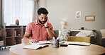 Finance, thinking and man in home with paperwork for budget planning, savings or investment with worry. Stress, debt and person with documents, bills and invoice for financial review, taxes or report
