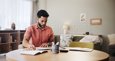 Buy stock photo Finance, budget and man in home with documents for financial planning, savings and investment. Reading, payment and person with paperwork, bills and invoice for mortgage, tax review and report