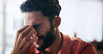 Man, frustrated and stress with headache, anxiety or depression in debt, mistake or financial crisis in home. Tired, male person and pain with migraine, pressure or strain in bankruptcy at house