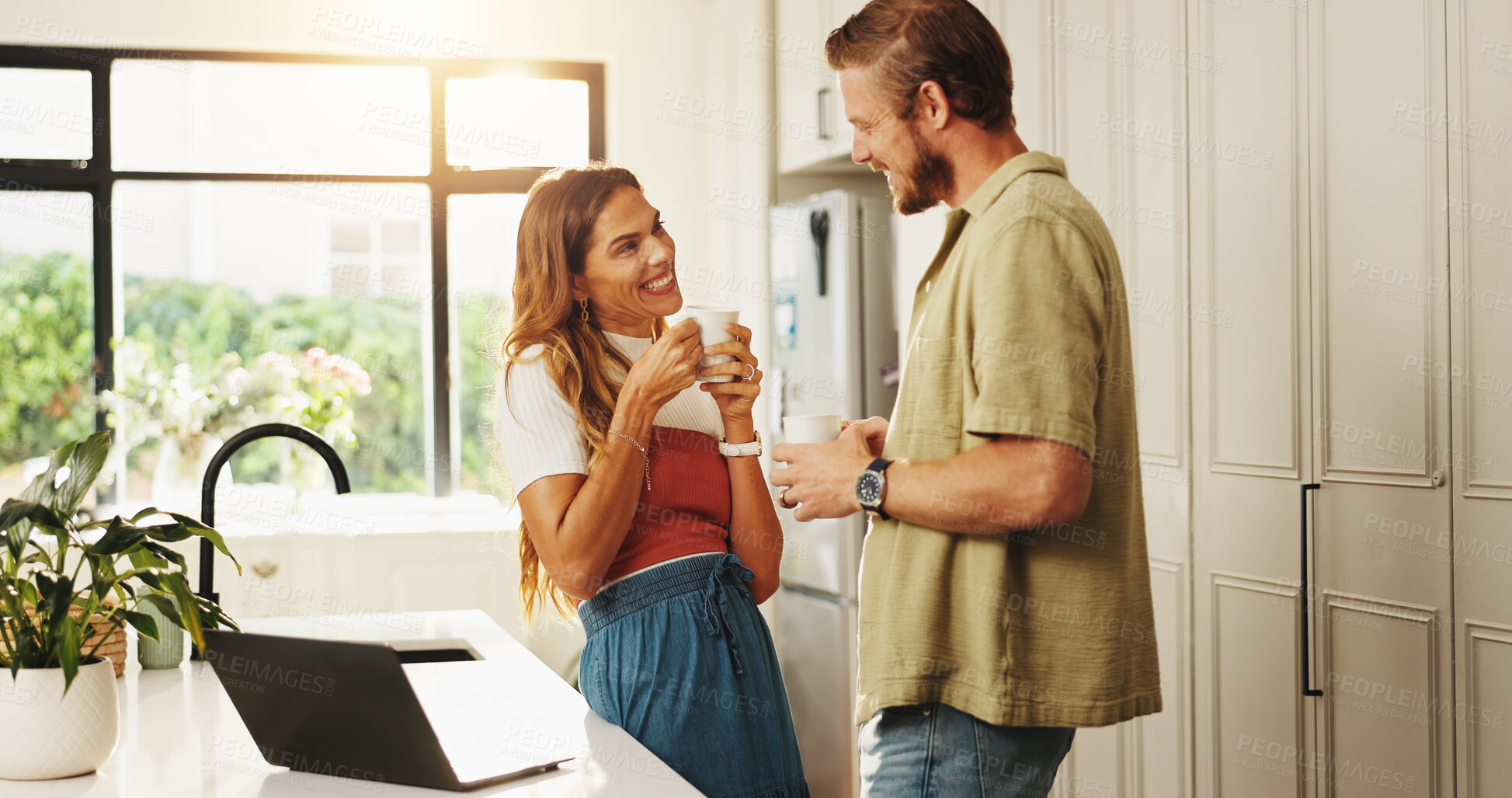 Buy stock photo Couple, happy and talk with coffee in kitchen, listening and connection with love at apartment. People, man and woman with discussion, care and bonding with tea, trust and loyalty with smile in home
