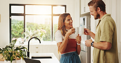 Buy stock photo Coffee, cheers and love with couple in kitchen for morning, bonding and support together. Happy, caffeine beverage and connection with man and woman and toast in home for tea, relax or success