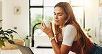 Reading, laptop and woman with coffee, kitchen or planning for article on social media or apartment. Remote work, blogger and person with tech for post on website, thinking and tea in morning or home