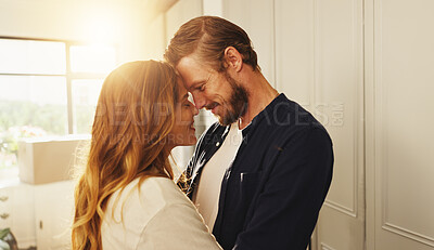 Buy stock photo Home, forehead and couple with love, smile or bonding together with happiness, romance or trust. Apartment, lens flare or man with woman, relationship or marriage with kindness, commitment or support