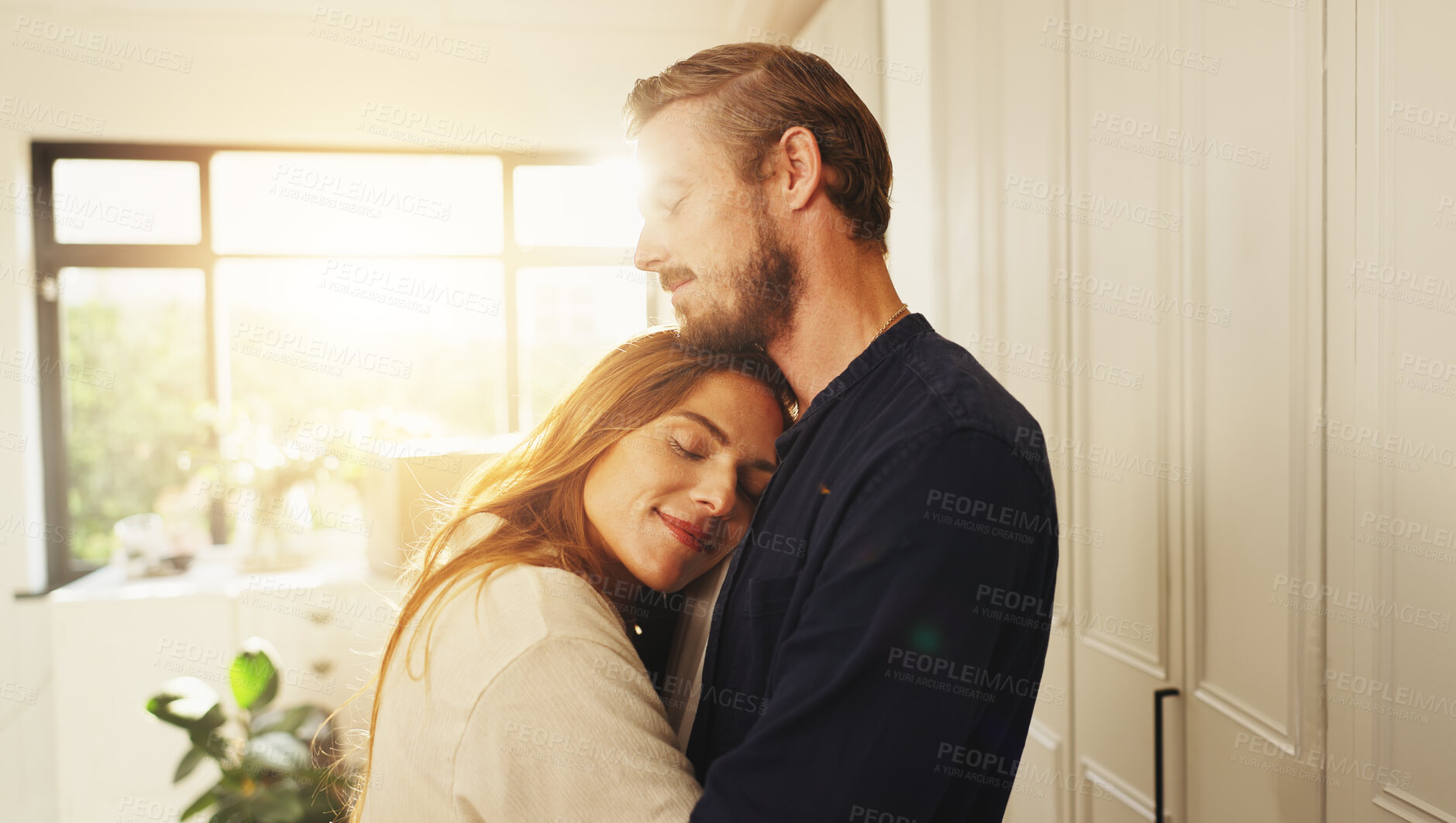 Buy stock photo Happy, love and couple hugging in kitchen for safety, care and marriage commitment together in home. Smile, connection and woman embracing man for relationship bonding on weekend morning in apartment