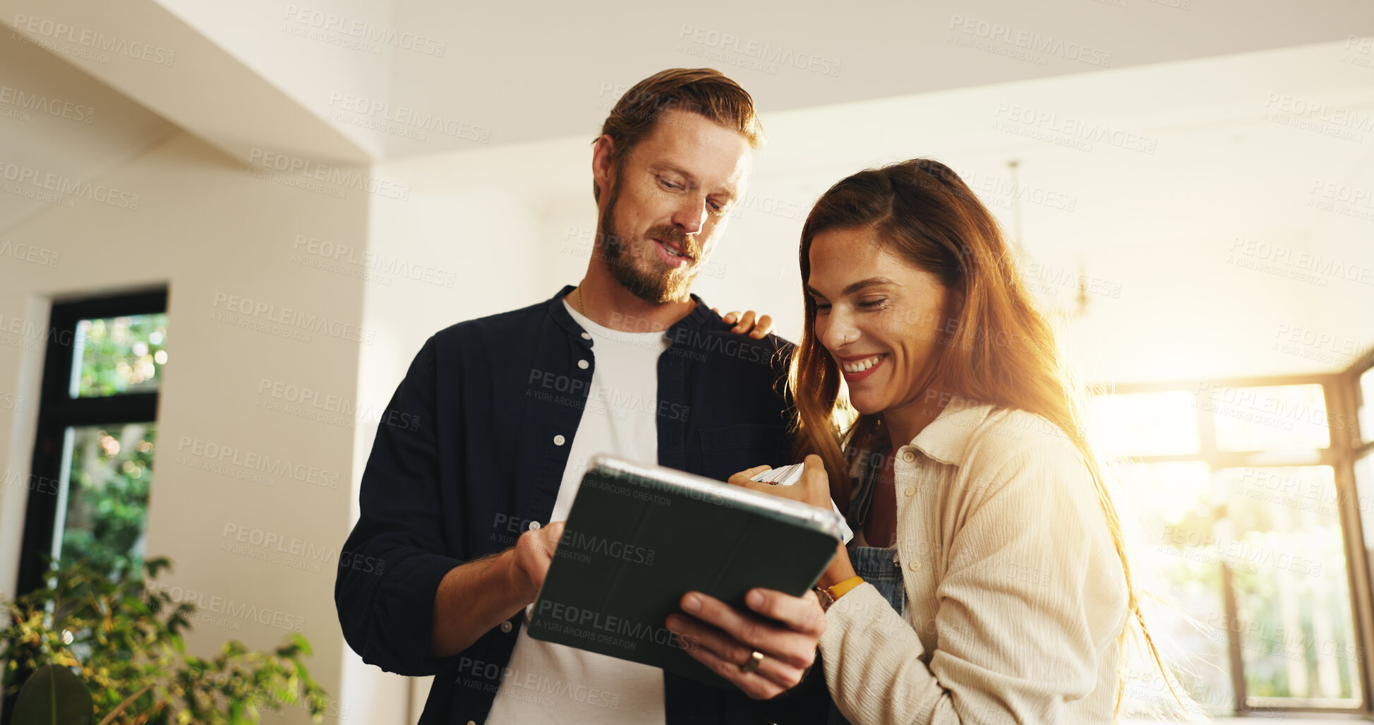 Buy stock photo Happy couple, tablet and planning in new home for interior design, DIY research or decor together. Man, woman or smile with technology for renovation, modeling app or digital layout for house vamping