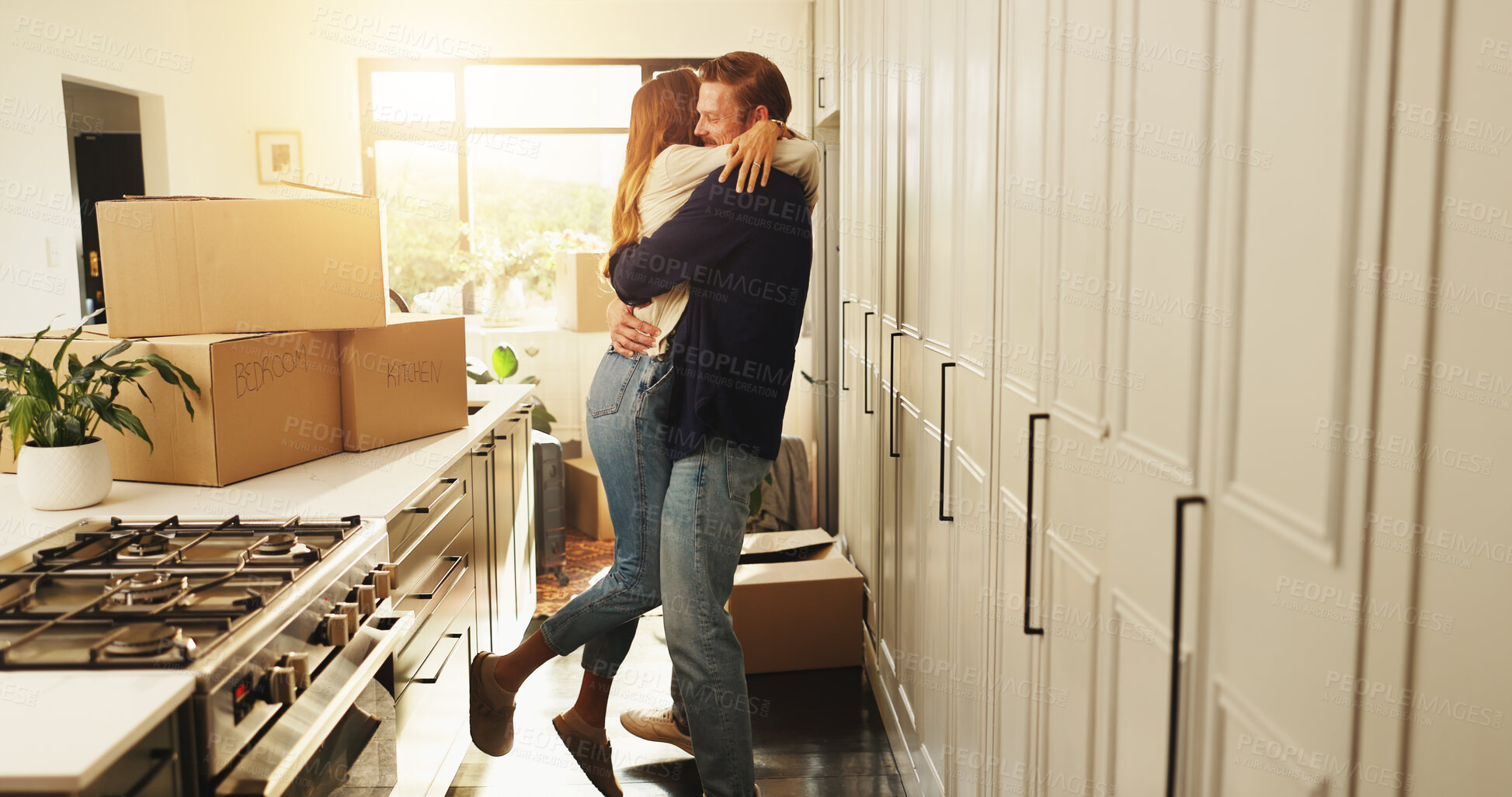 Buy stock photo Happy couple, hug and moving in with boxes for new home, fresh start or beginning together. Man, woman or lovers with embrace, packages or relocation for property, investment or security at house