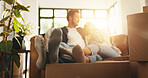 Couple, relax and couch with boxes at new house for relocation, investment and bonding together. People, lens flare and sofa for moving property, loan success and security for accommodation ownership