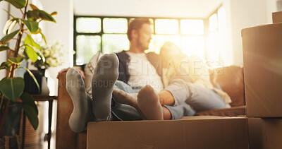 Buy stock photo Couple, relax and couch with boxes at new house for relocation, investment and bonding together. People, lens flare and sofa for moving property, loan success and security for accommodation ownership