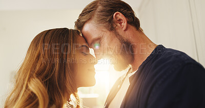 Buy stock photo Home, forehead and couple with love, lens flare or bonding together with happiness, romance or trust. Apartment, support or man with woman, relationship or marriage with kindness, commitment or smile