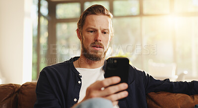 Buy stock photo Confused, phone and worry with man on sofa for phishing email, fake news and thinking. Virus warning, password leak and scam alert with person and mobile in living room of home for hacker threat
