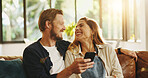 Happy, phone and couple on sofa laugh for online meme, internet joke and humor in home. Dating, relationship and man with woman on smartphone for social media, website and connection on weekend