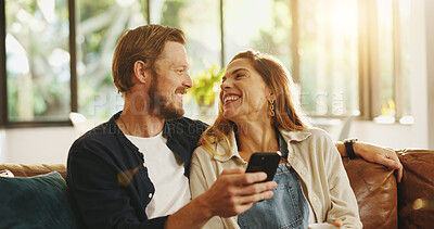 Buy stock photo Happy, phone and couple on sofa laugh for online meme, internet joke and humor in home. Dating, relationship and man with woman on smartphone for social media, website and connection on weekend