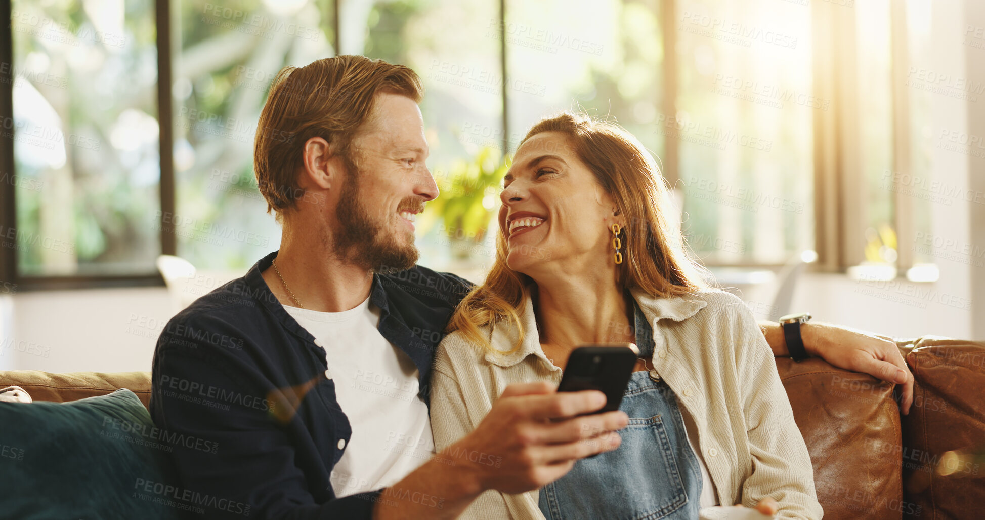 Buy stock photo Happy, phone and couple on sofa laugh for online meme, internet joke and humor in home. Dating, relationship and man with woman on smartphone for social media, website and connection on weekend