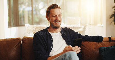 Buy stock photo Happy, sofa and man with phone in home for social media, online networking and chat on mobile app. Apartment, relax and person on smartphone for internet, contact and message notification on weekend