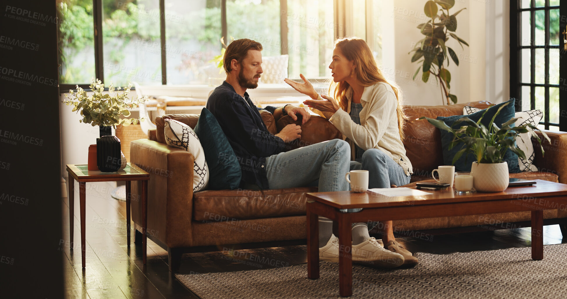 Buy stock photo Angry, argue or couple fight in home with cheating, affair or liar on couch with marriage or fail. Talk, frustrated or upset people on sofa in toxic relationship with divorce risk, stress or mistake