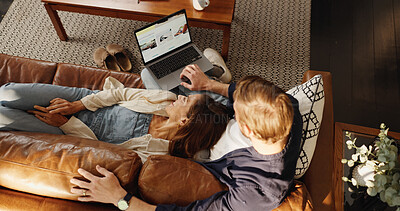 Buy stock photo Laptop, relax or top view of couple in home to search for deal on accommodation or hotel booking. Screen, holiday or people on couch together for bonding, travel options or resort homepage for review