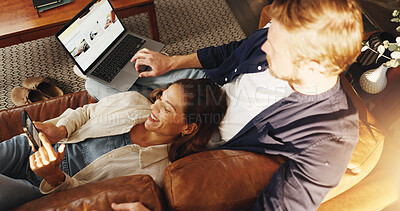 Buy stock photo Laptop, phone and above of couple on sofa for relax, chill and browse internet for bonding in home. Dating, relationship and man with woman on tech for social media, website and connection on weekend