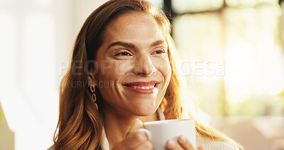 Buy stock photo Home, relax and woman with smile, coffee and morning with mocha brew, break and funny. Apartment, thinking and mature person on couch, cappuccino and start day with herbal tea, rest and reflection