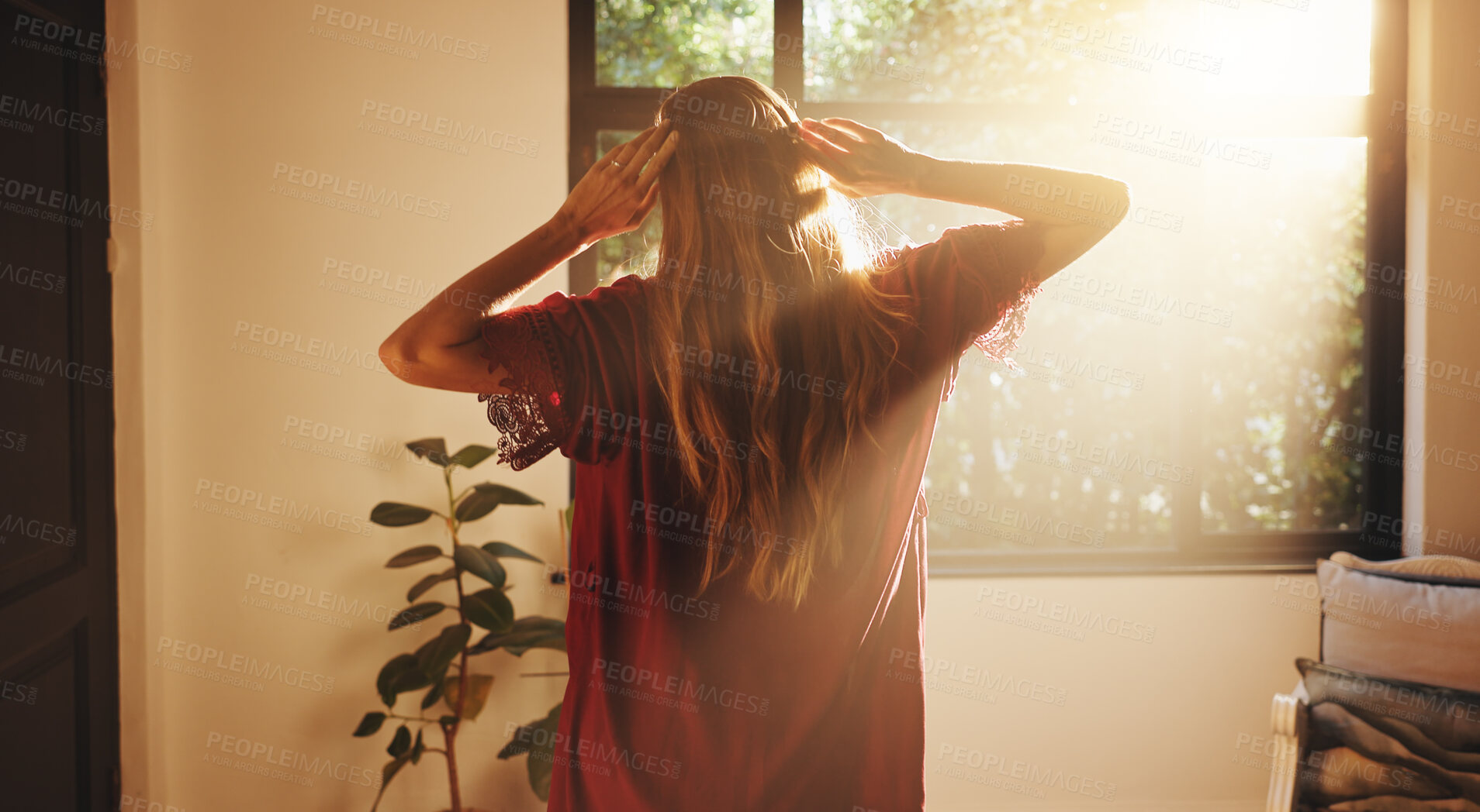 Buy stock photo Back, woman and stretching by window for sunshine, freedom and ready to start day in house. Home, good morning and person with view in bedroom for wake up, flare and fresh with energy on weekend