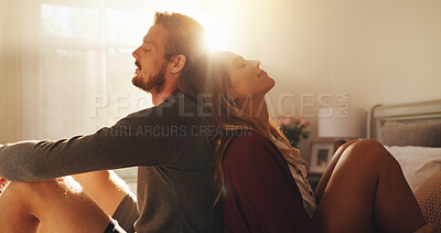 Buy stock photo Love, relax and support with couple in bedroom of home together for bonding or morning romance. Dating, rest or wellness with man and woman sitting on bed in apartment for safety, security or trust