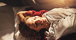 Above, relax and happy woman in bed with sunrise for comfort, resting and morning peace. Top view, thinking and person lying in bedroom for calm, wellness and dream with smile in home or apartment