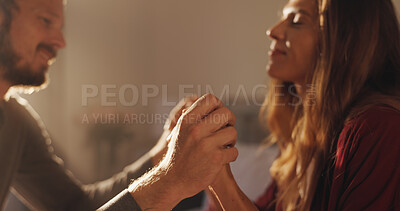 Buy stock photo Home, holding hands and couple in lounge, love and bonding together with marriage. Romance, commitment and man with woman, kindness and relationship with affection, happiness and weekend break