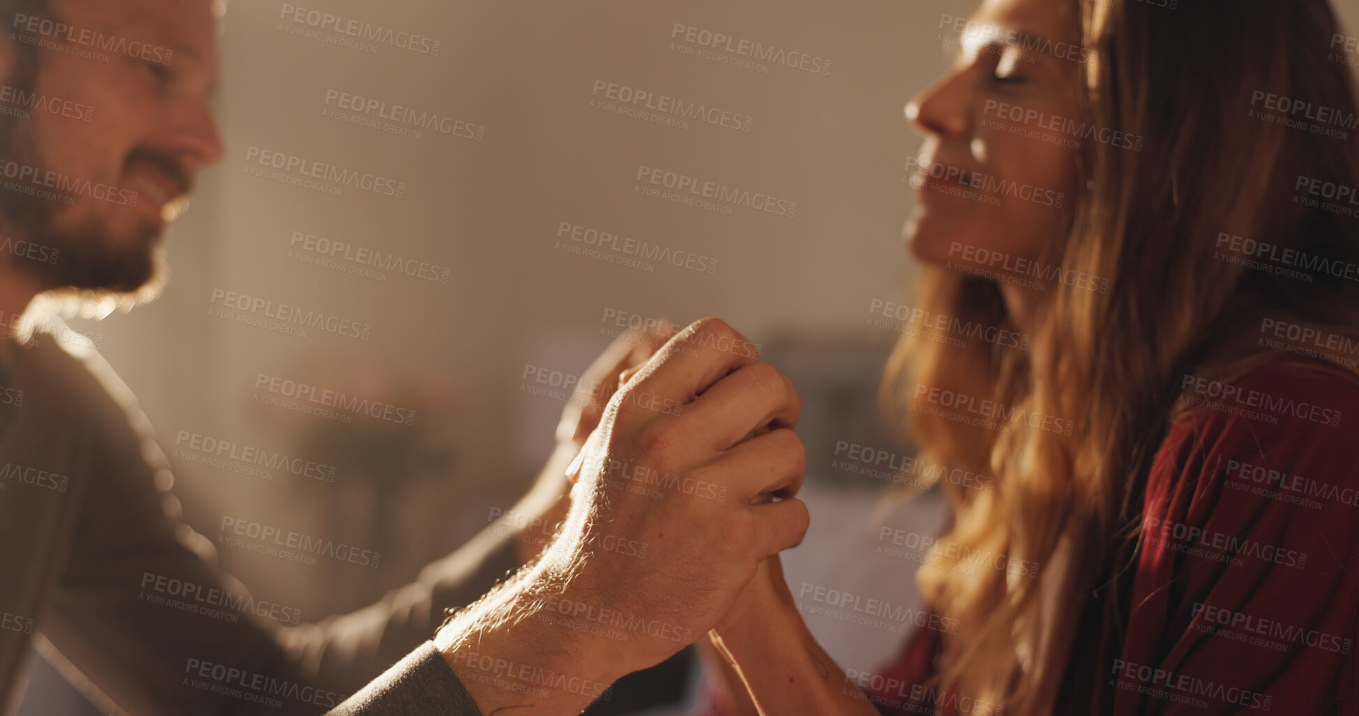 Buy stock photo Home, holding hands and couple in lounge, love and bonding together with marriage. Romance, commitment and man with woman, kindness and relationship with affection, happiness and weekend break