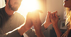 Home, hands together and couple with love, support and bonding with relationship. Romance, lens flare and man with woman, kindness and care with affection, happiness or marriage with commitment