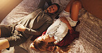 Happy couple, above and relax on bed for morning, comfort or day off together at home. Top view, man and woman lying in bedroom or sunshine for break, rest or nap on holiday or weekend at house