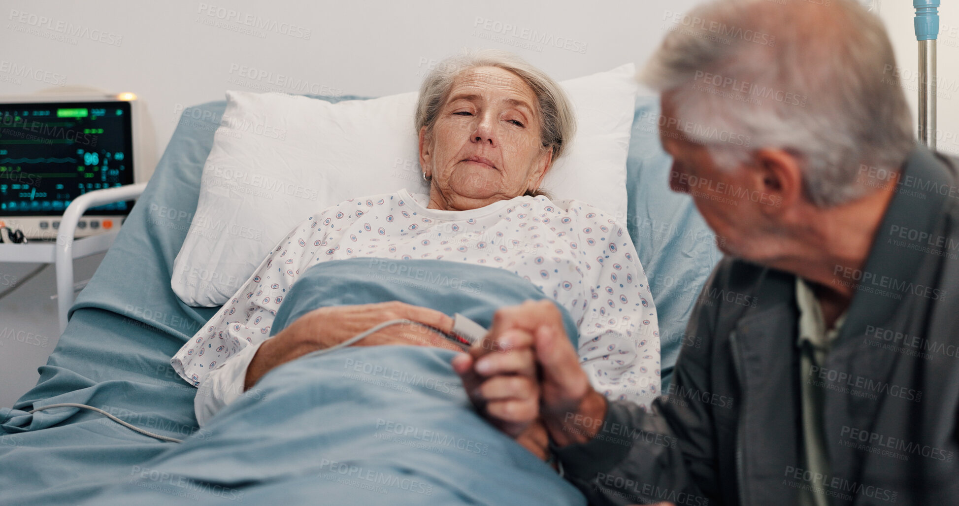 Buy stock photo Support, holding hands and healthcare with old couple in hospital for icu recovery, love and comfort. Medical, empathy and trust with senior man and patient in clinic for treatment, diagnosis or care