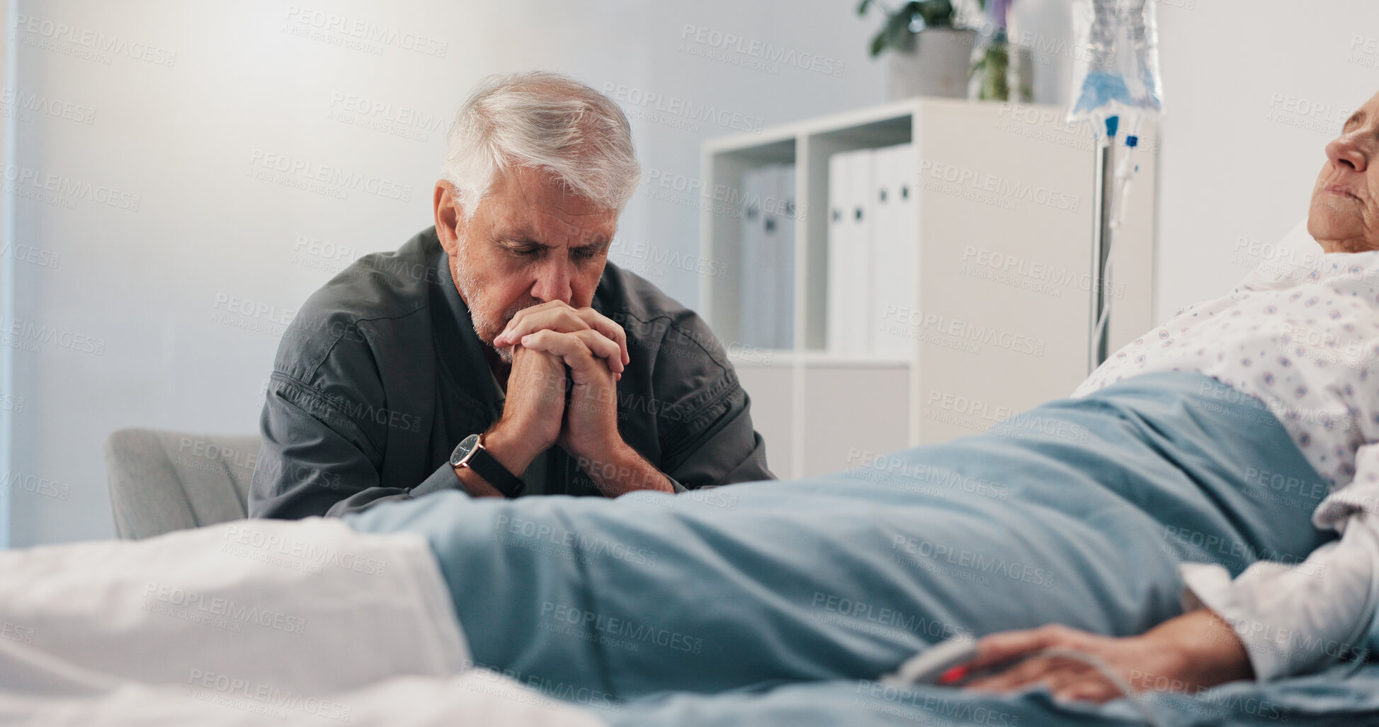 Buy stock photo Healthcare, hospital bed and senior man with hope, couple and prayer for recovery of partner or sad. Clinic, worried and elderly person with concern for cancer, sick and medical treatment for patient