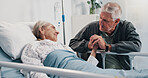 Holding hands, hospital bed and senior woman with husband for support, love and comfort for recovery. Healthcare, marriage and elderly patient with man for empathy with medical healing in clinic.