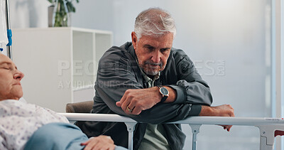 Buy stock photo Elderly couple, sick and man with worry by hospital bed, cancer diagnosis or think of healthcare. Disease, sad and clinic visitor with patient with illness, depression or stress for medical recovery